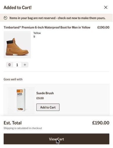 Timberland added-to-cart panel with a new line at the top saying items in your bag are not reserved