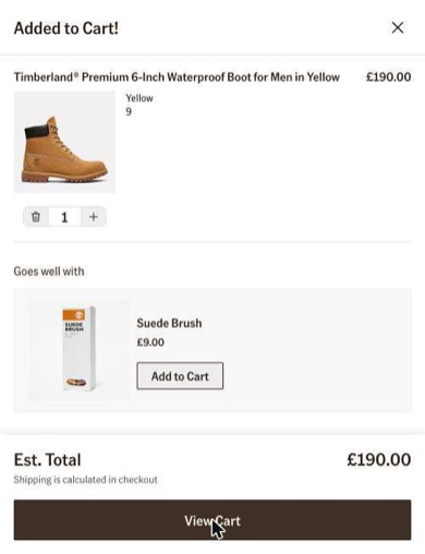 Timberland added-to-cart panel showing a yellow boot, a suede brush suggestion and a View Cart button
